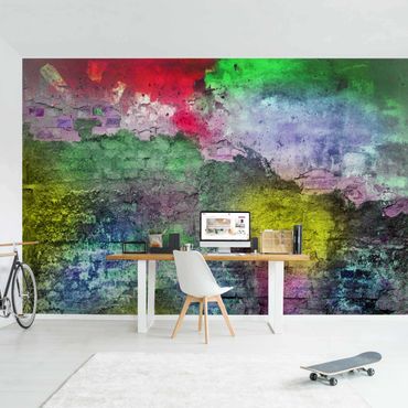 Fotobehang Colourful Sprayed Old Brick Wall