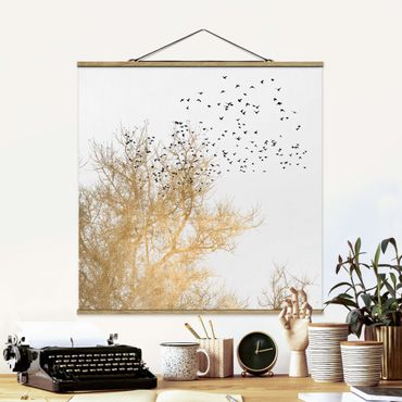 Stoffen schilderij met posterlijst Flock Of Birds In Front Of Golden Tree