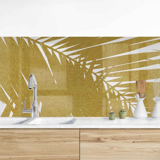 Achterwand voor keuken bloemen View Through Golden Palm Leaves