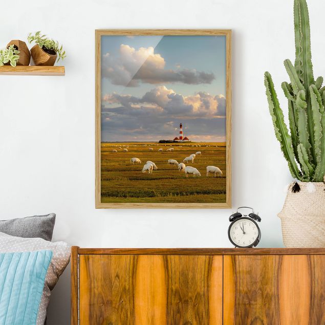 Ingelijste posters North Sea Lighthouse With Flock Of Sheep