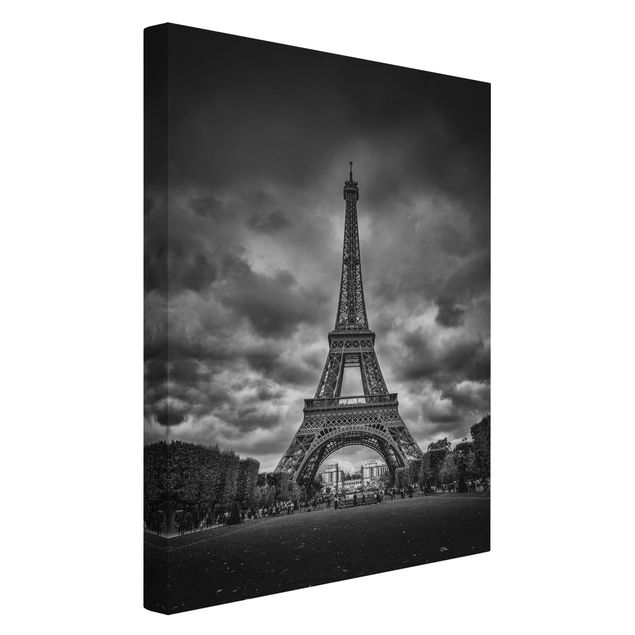 Canvas schilderijen Eiffel Tower In Front Of Clouds In Black And White