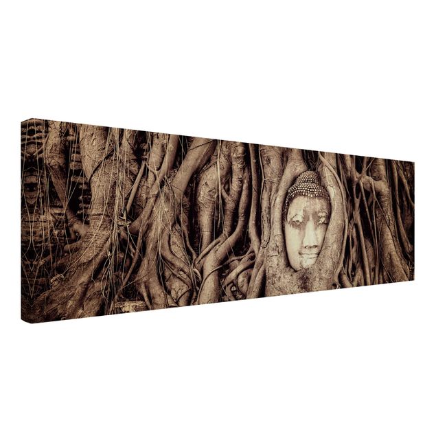 Canvas schilderijen Buddha In Ayutthaya Lined From Tree Roots In Black And White
