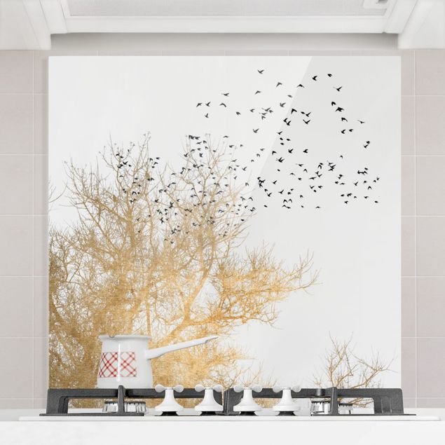 Spatscherm keuken Flock Of Birds In Front Of Golden Tree