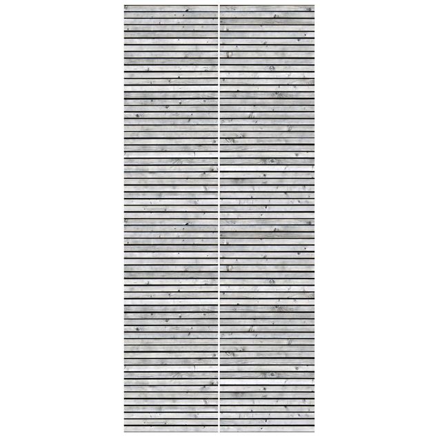 Deur behang Wooden Wall With Narrow Strips Black And White