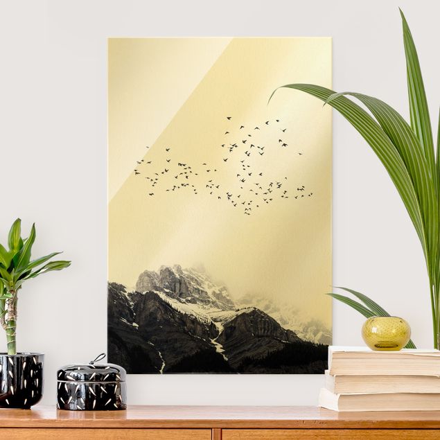 Glas Magnetboard Flock Of Birds In Front Of Mountains Black And White