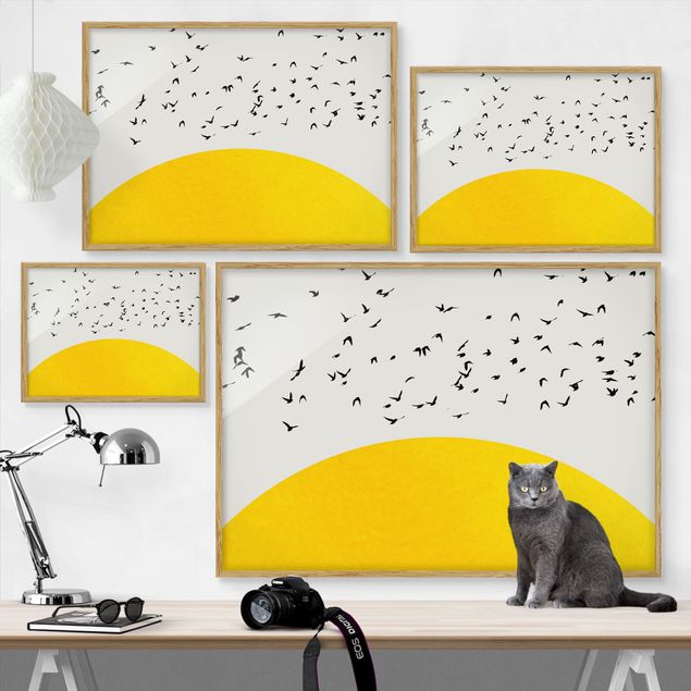 Ingelijste posters Flock Of Birds In Front Of Yellow Sun