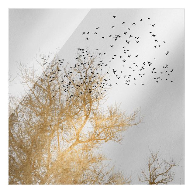 Glasschilderijen Flock Of Birds In Front Of Golden Tree